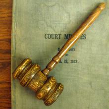 Image of a gavel resting on a court document